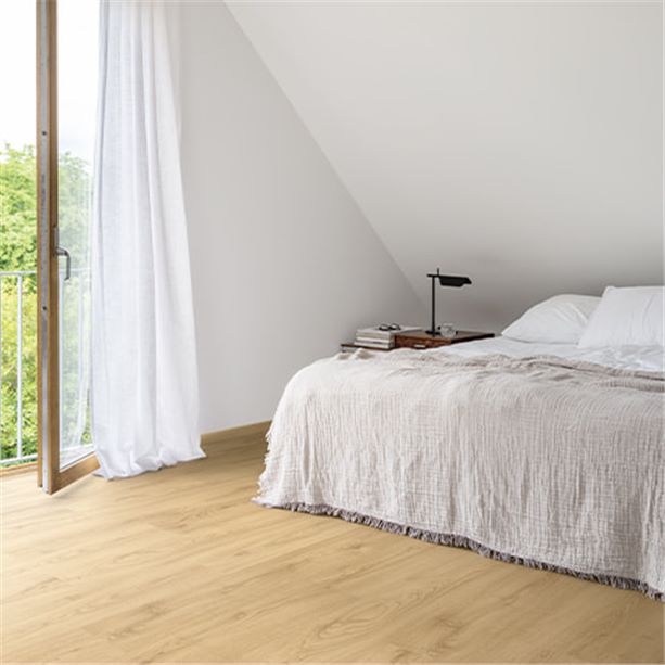 bedroom with big window and a beige laminate floor